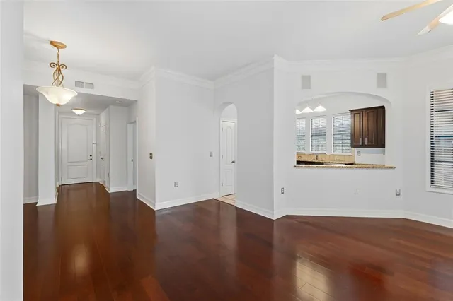 a large kitchen with a stove a refrigerator and a sink