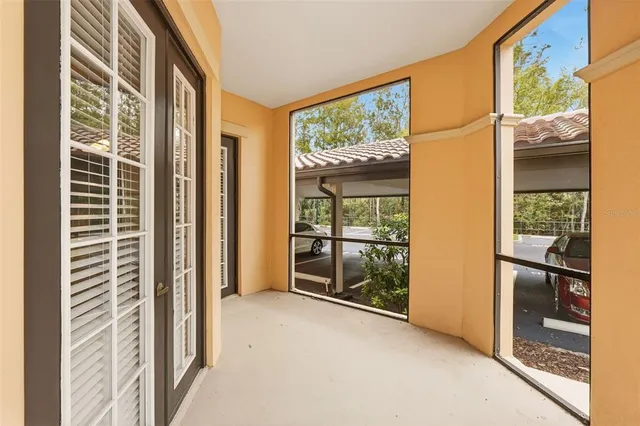 a living room with furniture rug and painting on the wall