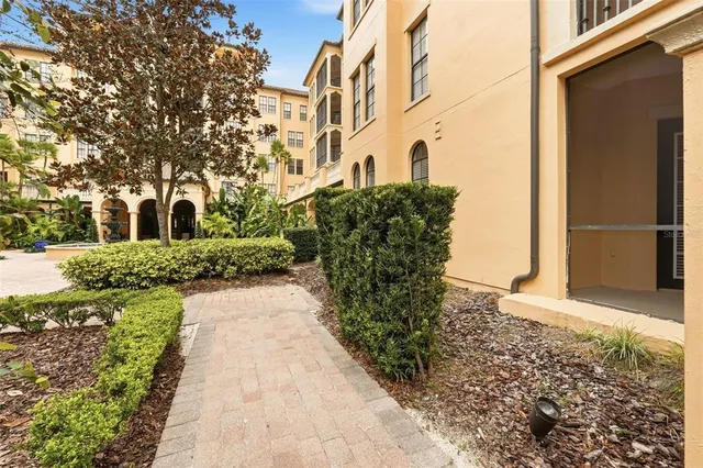 a room with furniture pool table wooden floor and a large window