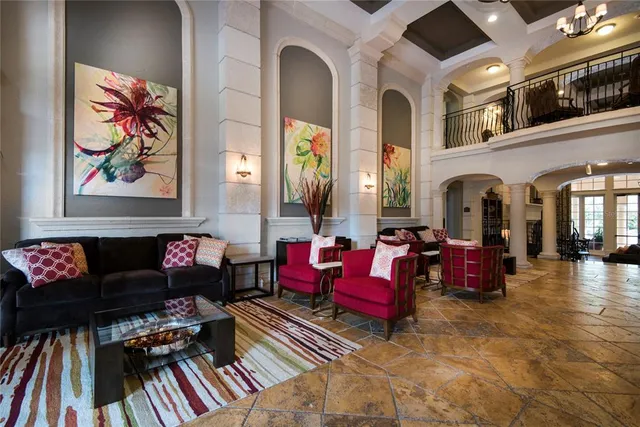 a view of a dining room with furniture a chandelier and wooden floor