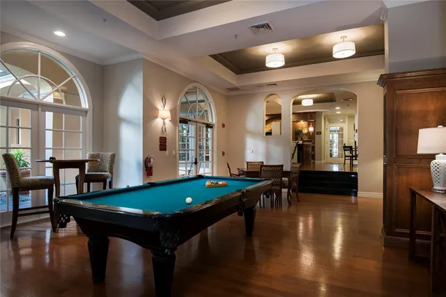 a view of a balcony with wooden floor and lake view