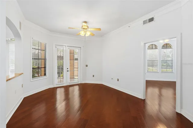 a view of a room with wooden floor and staircase