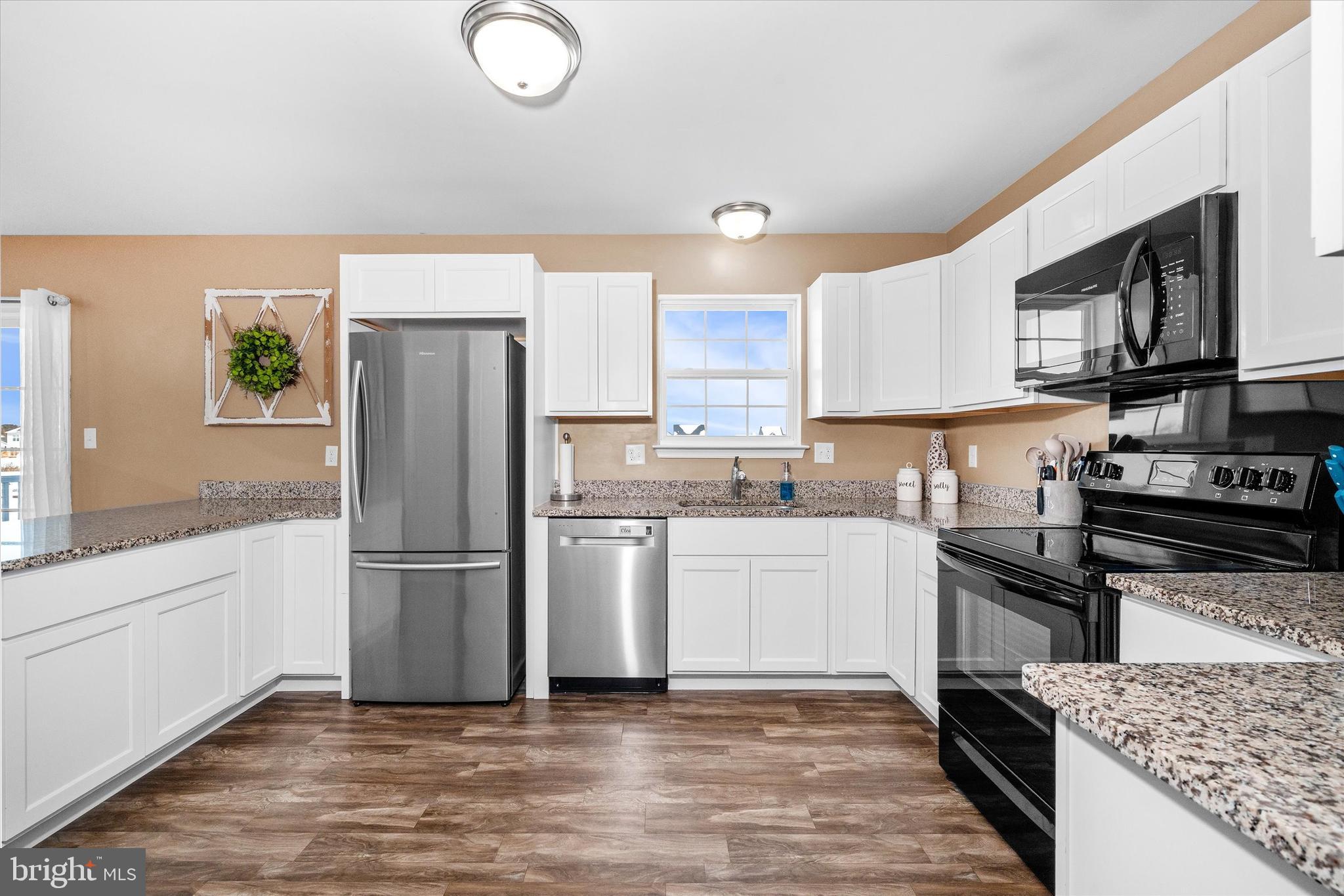 312 Doylestown Road Smyrna, DE 19977 - Photo 16 of 36 a kitchen with a refrigerator stove and microwave