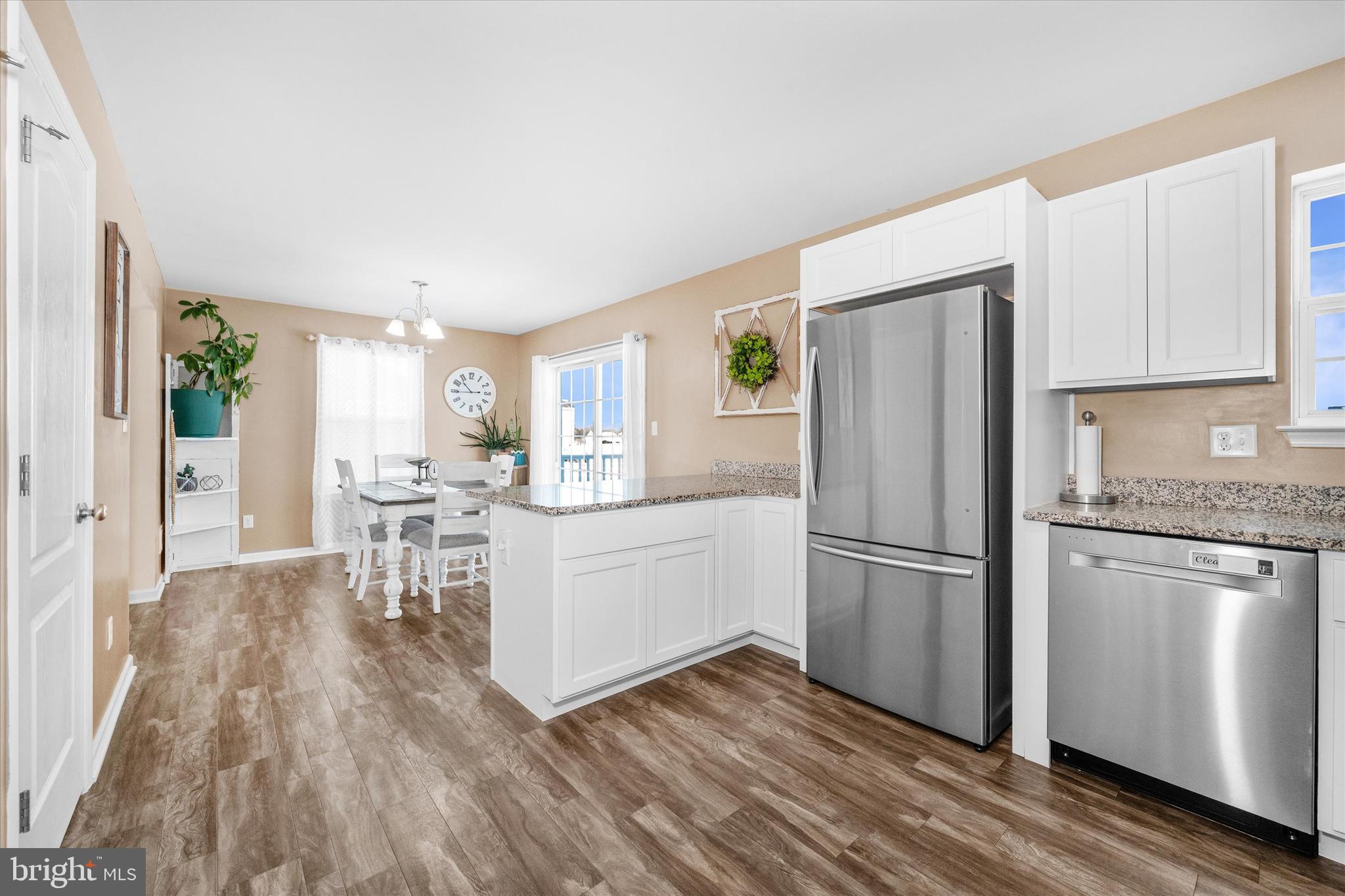 312 Doylestown Road Smyrna, DE 19977 - Photo 17 of 36 a kitchen with white cabinets and stainless steel appliances
