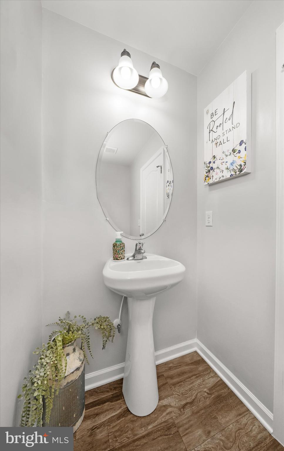 312 Doylestown Road Smyrna, DE 19977 - Photo 19 of 36 a bathroom with a sink toilet and mirror