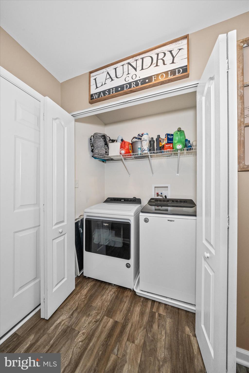 312 Doylestown Road Smyrna, DE 19977 - Photo 20 of 36 a kitchen with white cabinets and a wooden floor