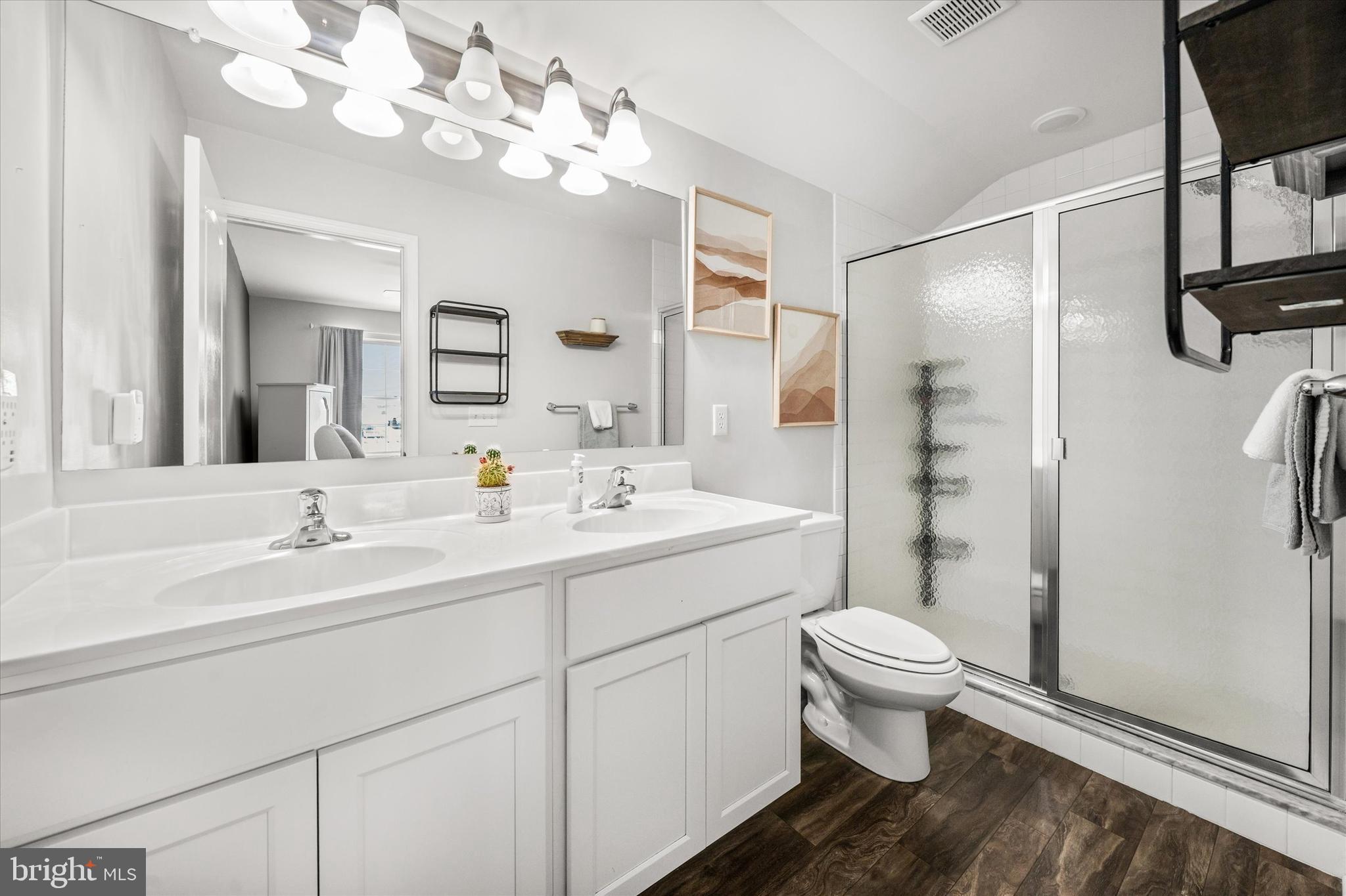 312 Doylestown Road Smyrna, DE 19977 - Photo 24 of 36 a bathroom with a sink a toilet and a mirror