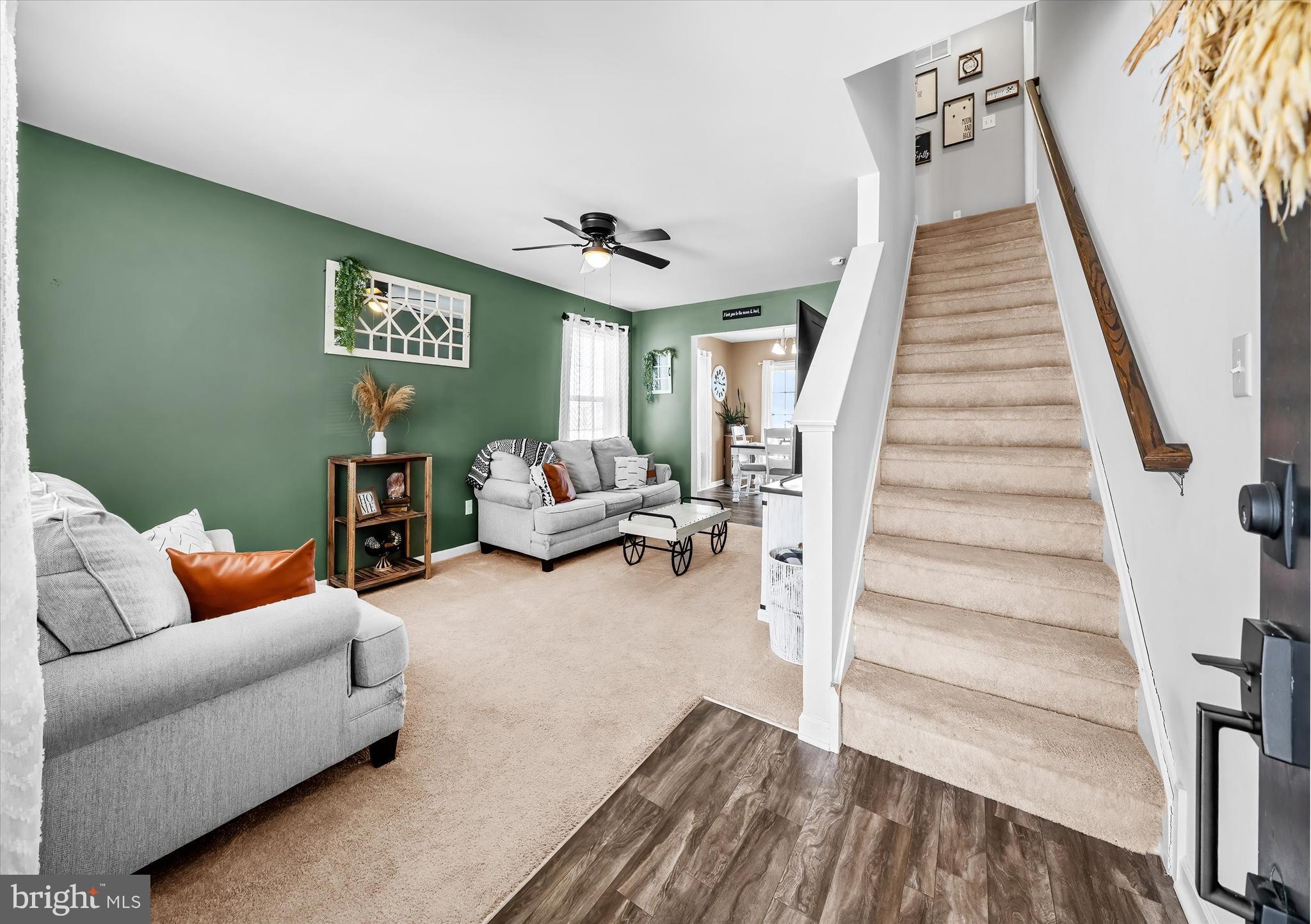 312 Doylestown Road Smyrna, DE 19977 - Photo 5 of 36 a living room with furniture and a wooden floor
