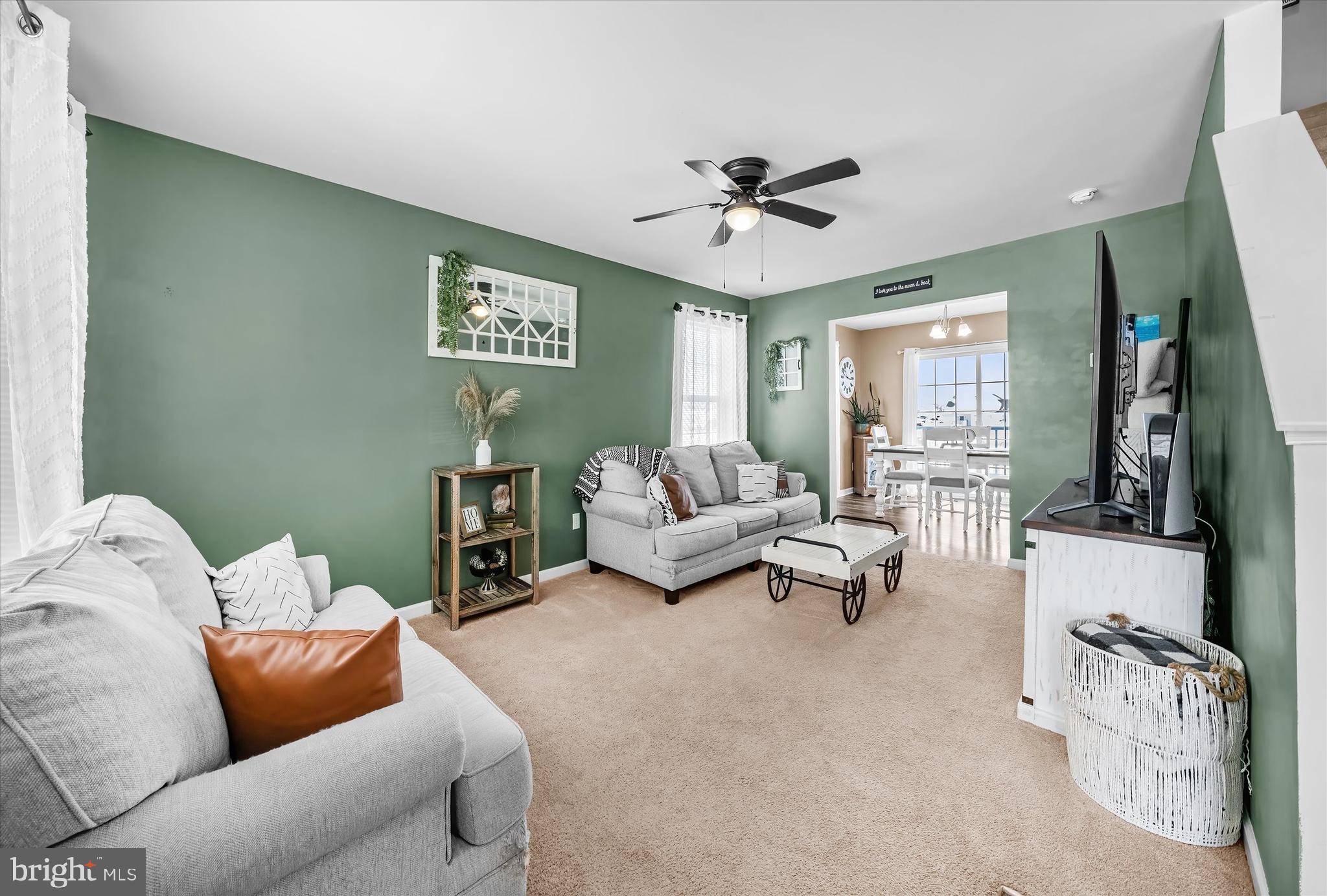 312 Doylestown Road Smyrna, DE 19977 - Photo 6 of 36 a living room with furniture and a flat screen tv