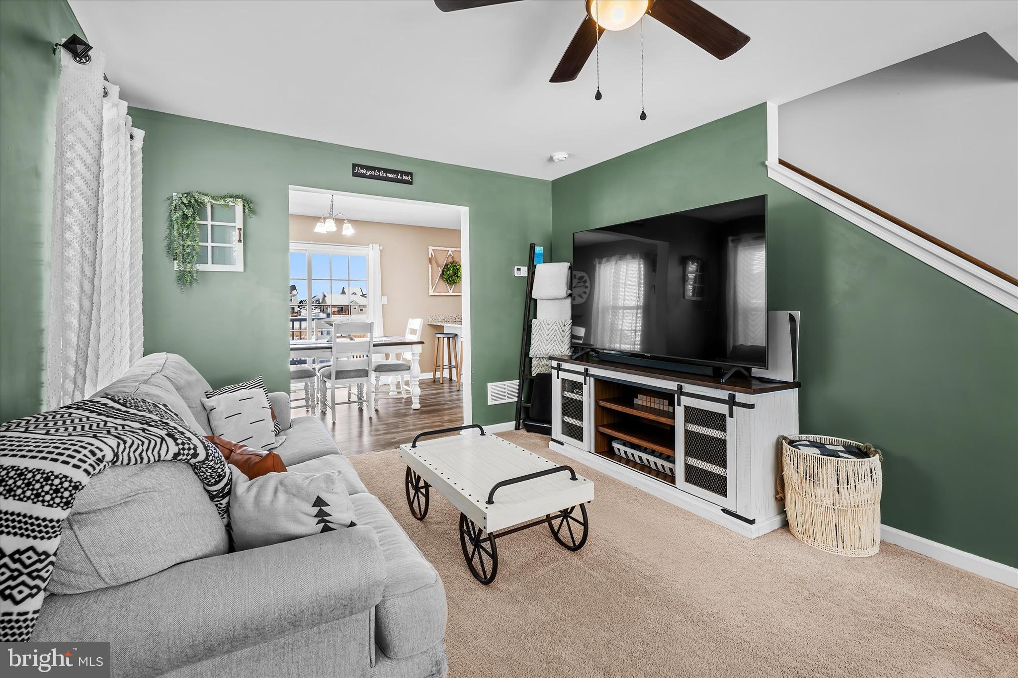 312 Doylestown Road Smyrna, DE 19977 - Photo 8 of 36 a living room with furniture and a flat screen tv