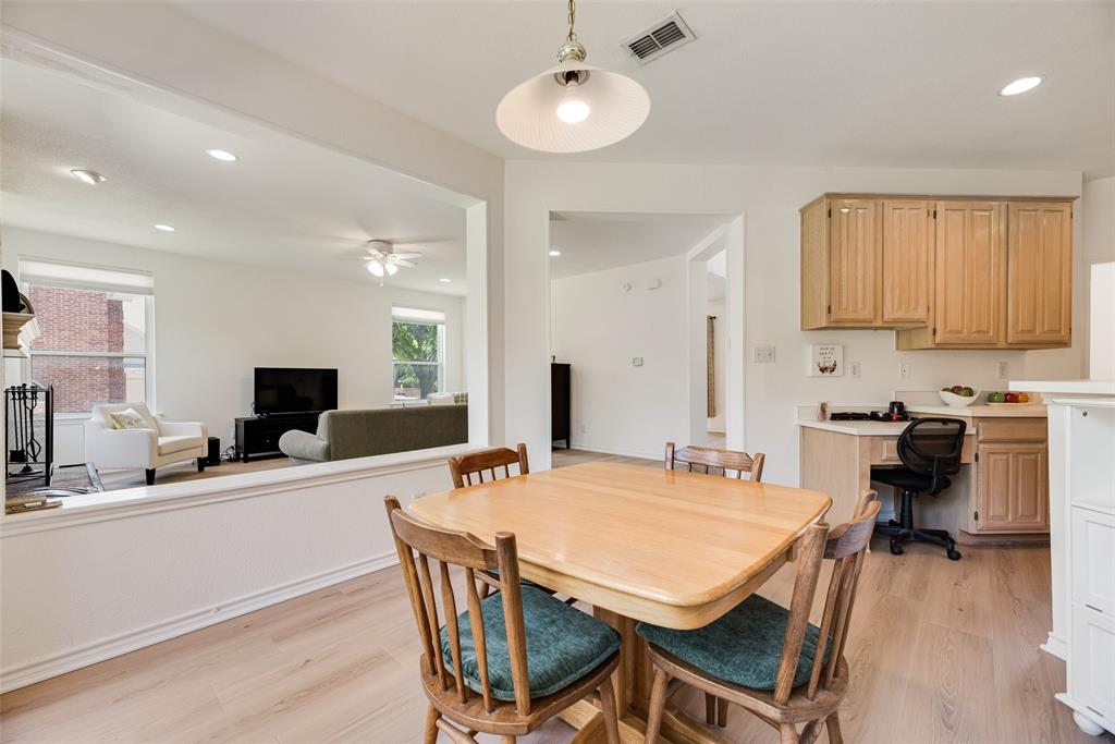 1406 West Peters Colony Road Carrollton, TX 75007 - Photo 26 of 29 a large kitchen with a table and chairs