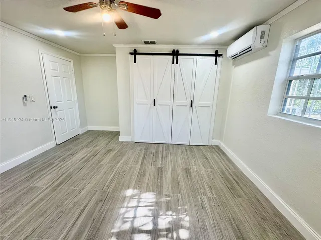 a view of entryway with wooden floor
