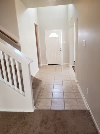 a kitchen with granite countertop a stove and a microwave