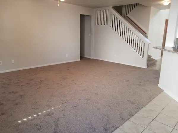 a view of empty room with window and fireplace