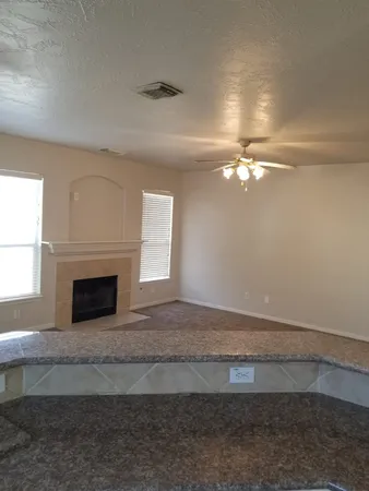 an empty room with closet and a bathroom