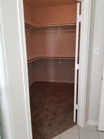 an empty room with a fireplace