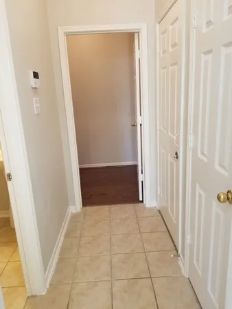 a view of a livingroom with an empty space and a fireplace