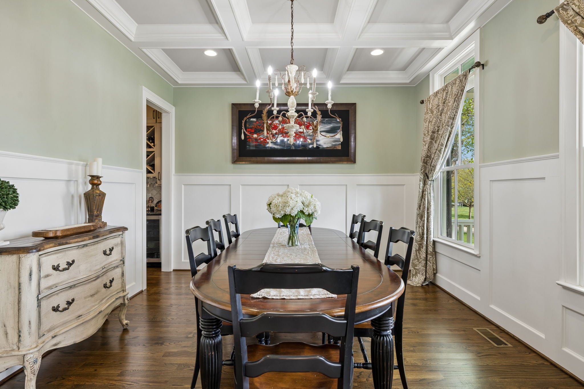 6033 Native Pony Trail College Grove, TN 37046 - Photo 14 of 87 a view of a dining room with furniture a chandelier and wooden floor