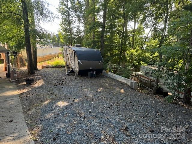 105 River Ridge Trail Mount Gilead, NC 27306 - Photo 11 of 16 a backyard of a house with fountain table and chairs