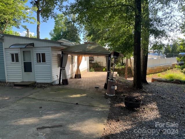 105 River Ridge Trail Mount Gilead, NC 27306 - Photo 13 of 16 a view of a house with backyard