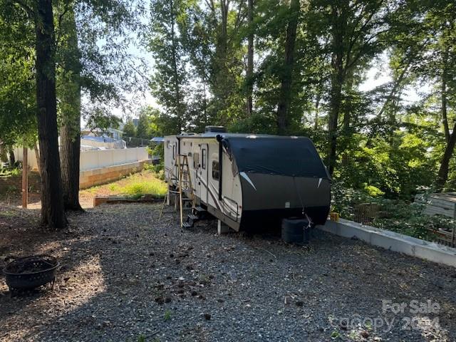 105 River Ridge Trail Mount Gilead, NC 27306 - Photo 15 of 16 a backyard of a house with outdoor seating and trees