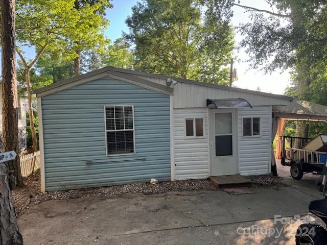 105 River Ridge Trail Mount Gilead, NC 27306 - Photo 16 of 16 a view of a house with a yard