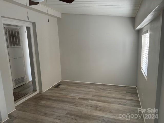 105 River Ridge Trail Mount Gilead, NC 27306 - Photo 7 of 16 a view of an empty room with wooden floor and a window