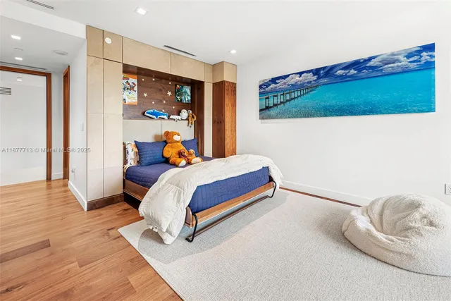 a bedroom with a bed and a table