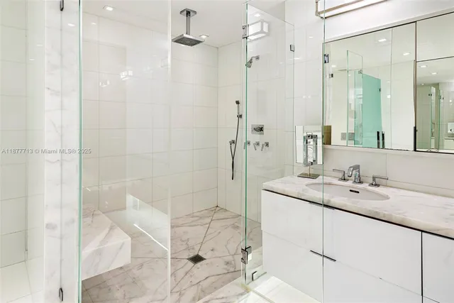 a view of walk in closet with clothes