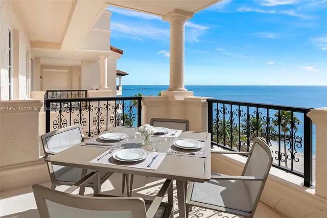 a view of swimming pool with outdoor seating and city view