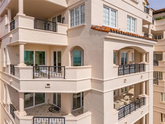 a view of tall buildings and a big yard