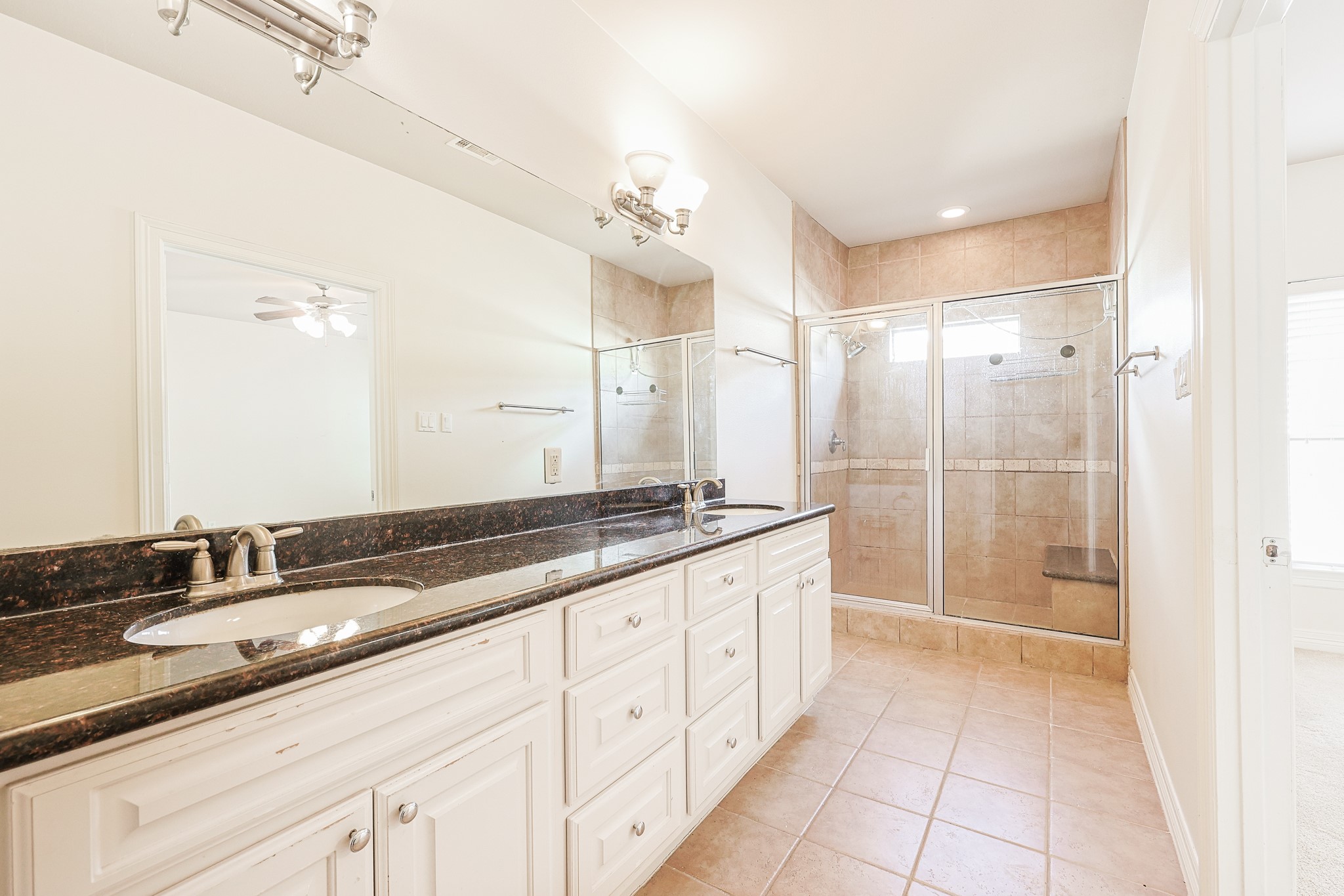 2540 Prospect Street, Unit C Houston, TX 77004 - Photo 19 of 31 a spacious bathroom with a granite countertop sink mirror and double
