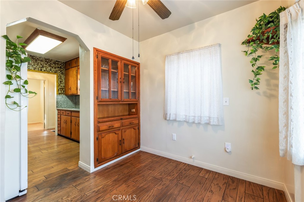1001 West 134th Street Compton, CA 90222 - Photo 14 of 44 a view of an empty room with wooden floor and a window