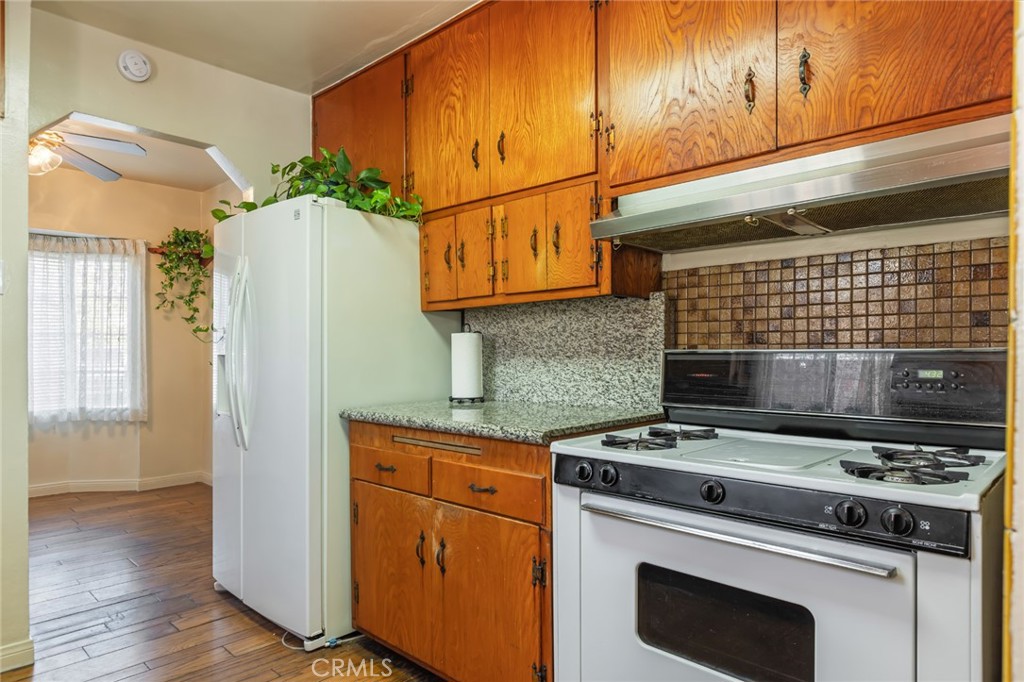 1001 West 134th Street Compton, CA 90222 - Photo 16 of 44 a kitchen with a stove and a microwave