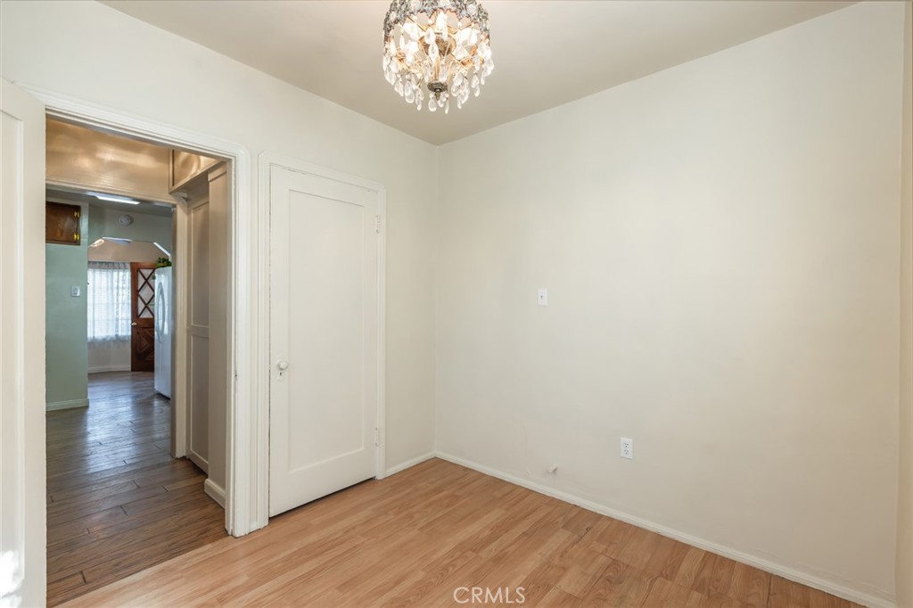 1001 West 134th Street Compton, CA 90222 - Photo 21 of 44 a view of an empty room with wooden floor