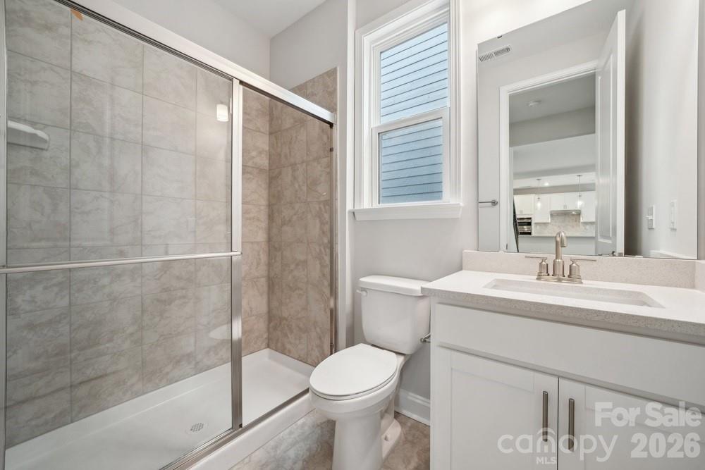 5041 Duval Circle Tega Cay, SC 29708 - Photo 21 of 47 a bathroom with a sink toilet and shower