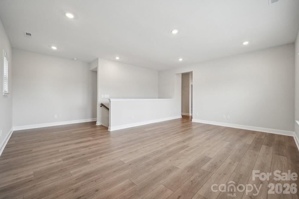 5041 Duval Circle Tega Cay, SC 29708 - Photo 23 of 47 a view of an empty room with wooden floor