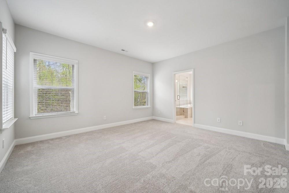 5041 Duval Circle Tega Cay, SC 29708 - Photo 25 of 47 an empty room with windows