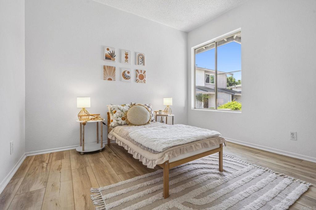 3431 Seabreeze Walk Oceanside, CA 92056 - Photo 14 of 23 a bedroom with a bed and a dresser