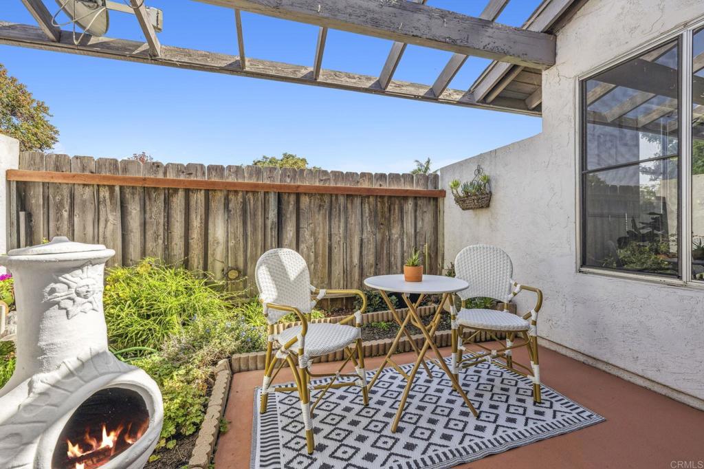 3431 Seabreeze Walk Oceanside, CA 92056 - Photo 19 of 23 a view of a chairs and table in patio