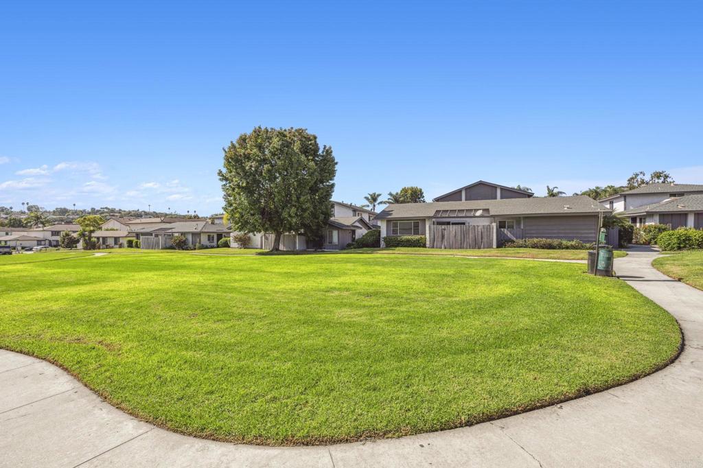 3431 Seabreeze Walk Oceanside, CA 92056 - Photo 21 of 23 a view of a house with a big yard