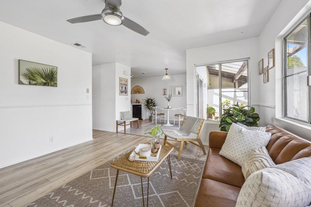 3431 Seabreeze Walk Oceanside, CA 92056 - Photo 7 of 23 a living room with furniture and a large window