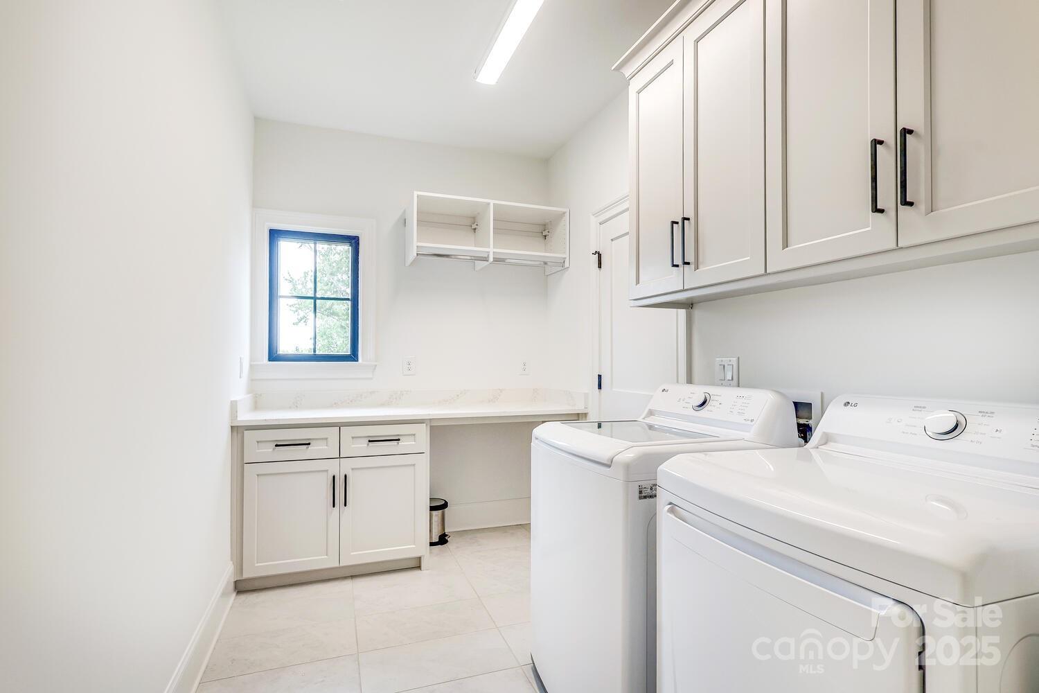 5511 Fairview Road Charlotte, NC 28209 - Photo 27 of 45 a view of cabinets a sink and a stove top oven