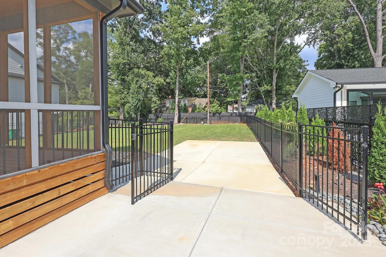 5511 Fairview Road Charlotte, NC 28209 - Photo 40 of 45 a view of balcony with wooden floor and fence