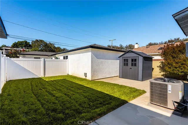 a view of a pathway with a house in the background