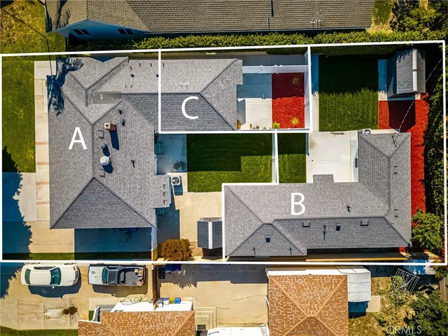 an aerial view of houses with street