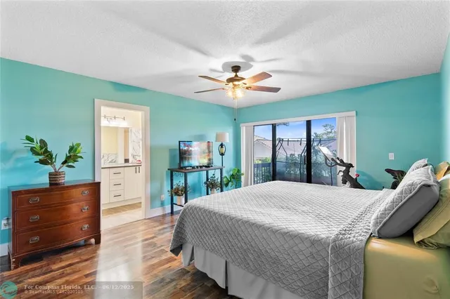 a bathroom with a granite countertop sink a mirror and a shower