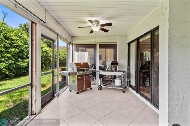 a view of a room with furniture fire place and garden view