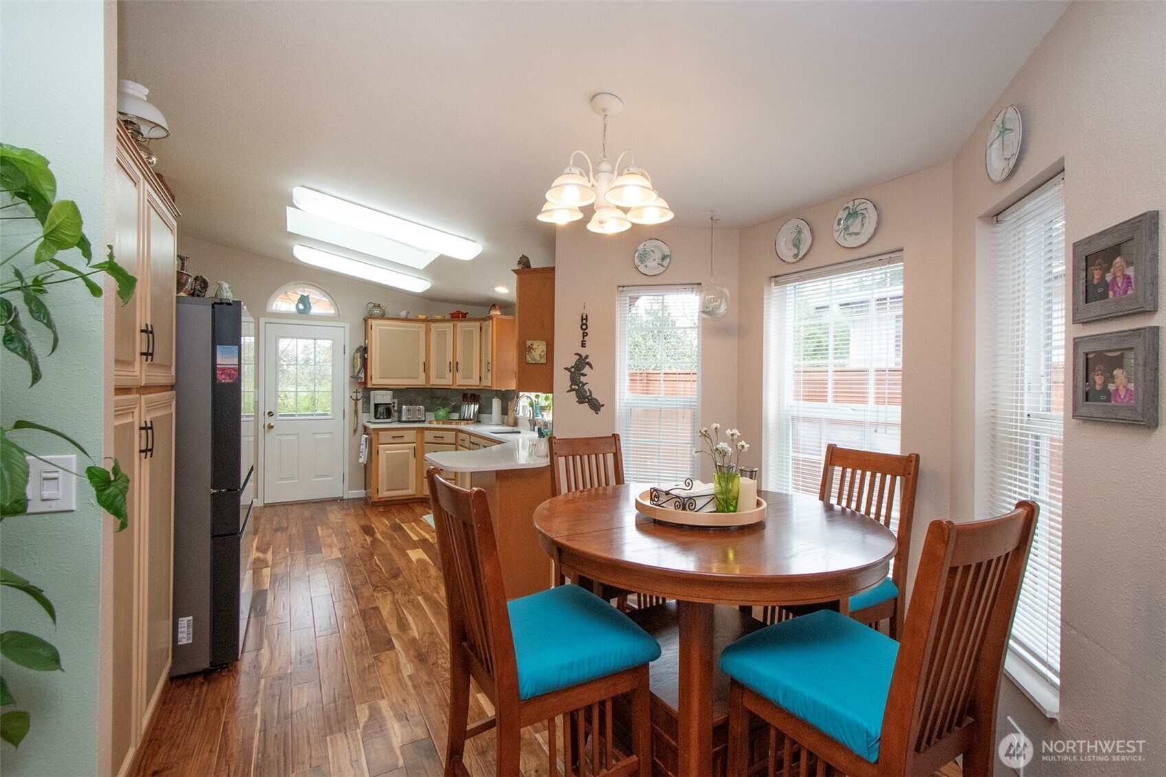151 Green Meadows Drive Sequim, WA 98382 - Photo 13 of 40 a view of a dining room with furniture a chandelier and wooden floor