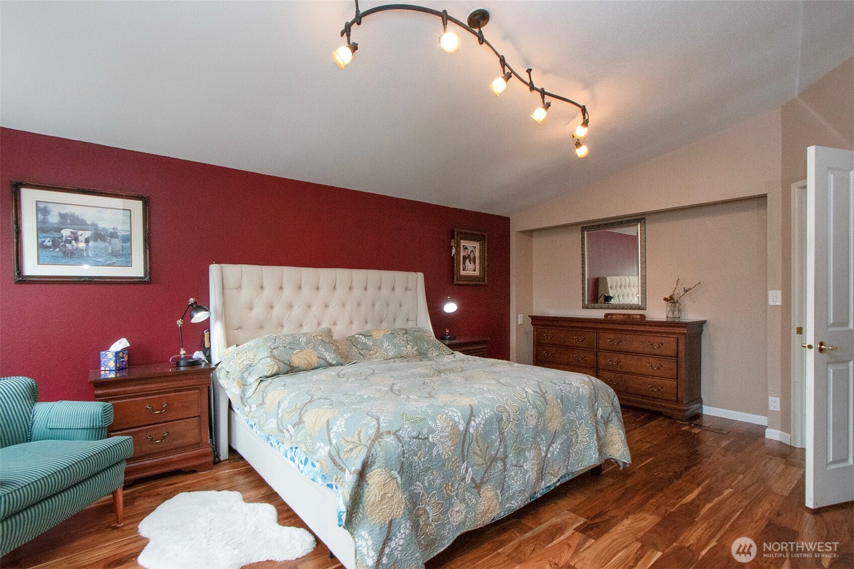 151 Green Meadows Drive Sequim, WA 98382 - Photo 18 of 40 a bedroom with a bed and a couch